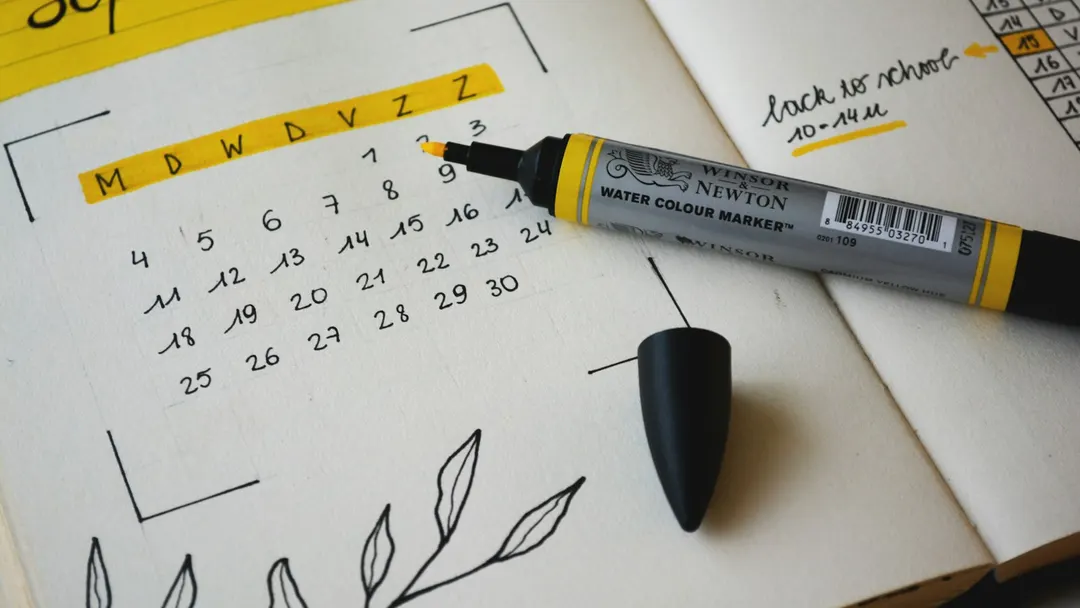 Desk planner and calendar used to schedule dental appointments before insurance benefits reset